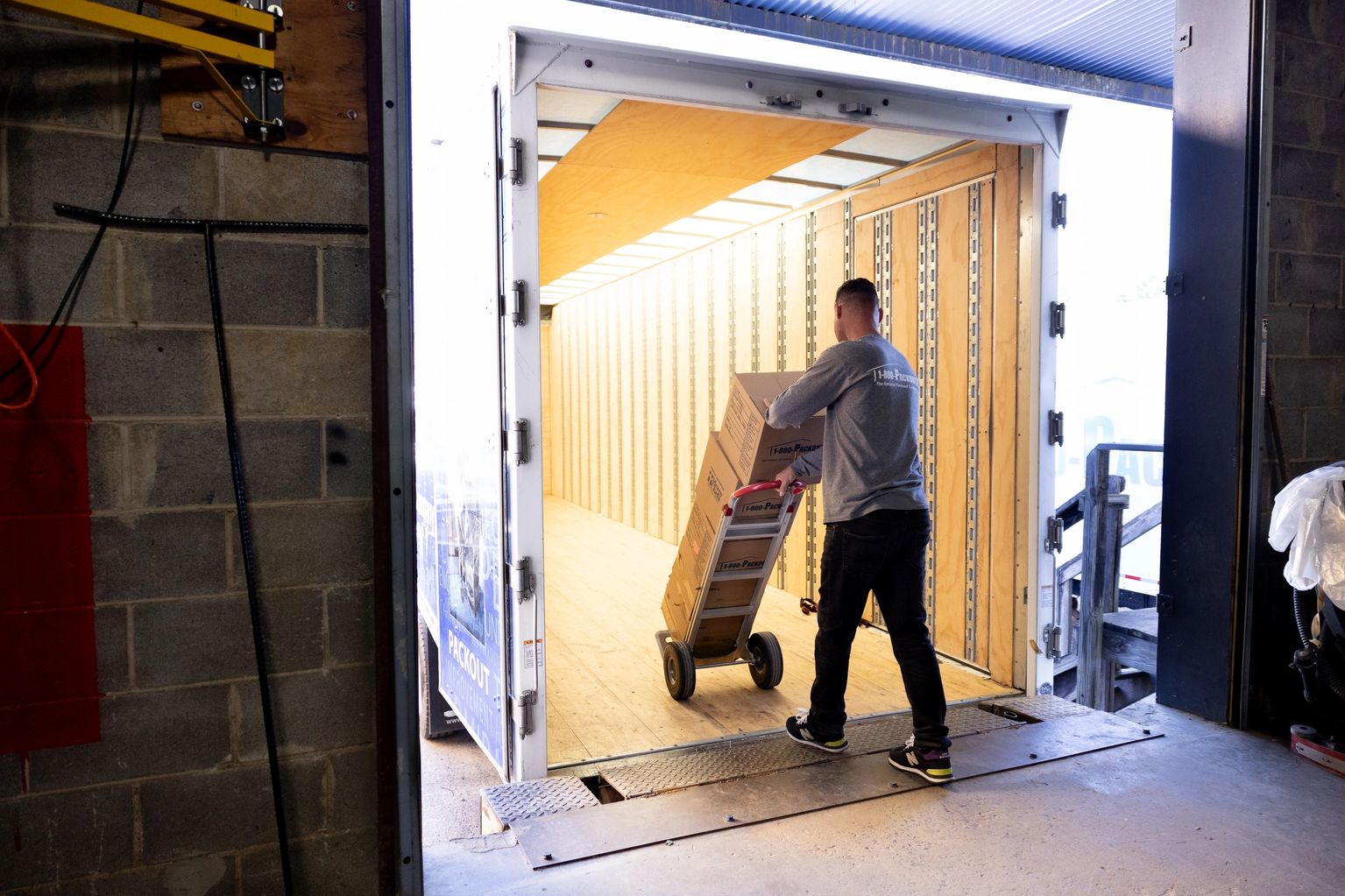 Packout professionals carefully packing home contents