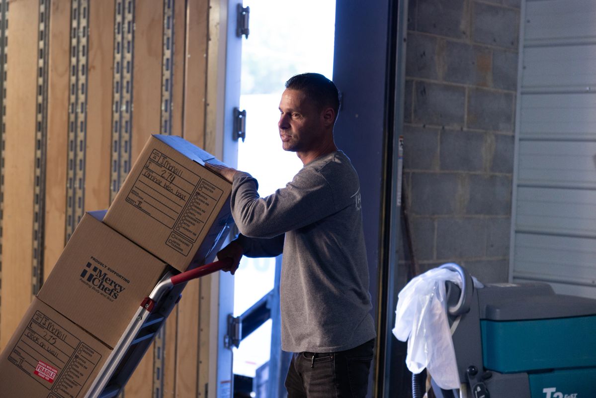 Team returning contents to a restored home